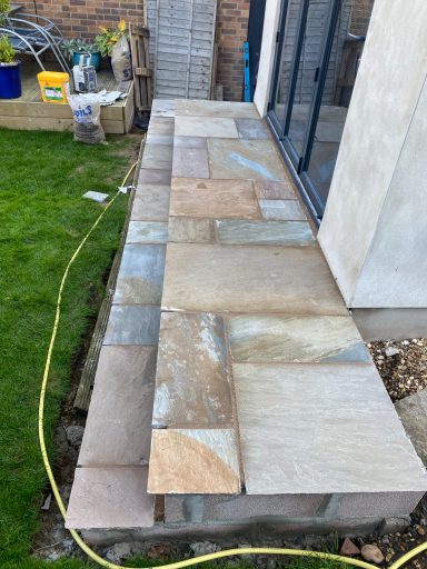 Sandstone steps leading to bi-fold doors